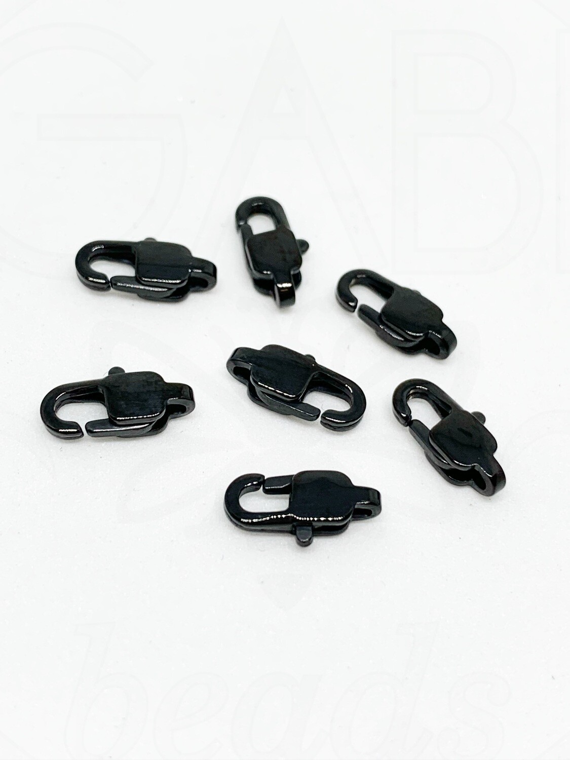 Nerūdijančio plieno užsegimas, juodos spalvos 11x5,5mm, 1 vnt