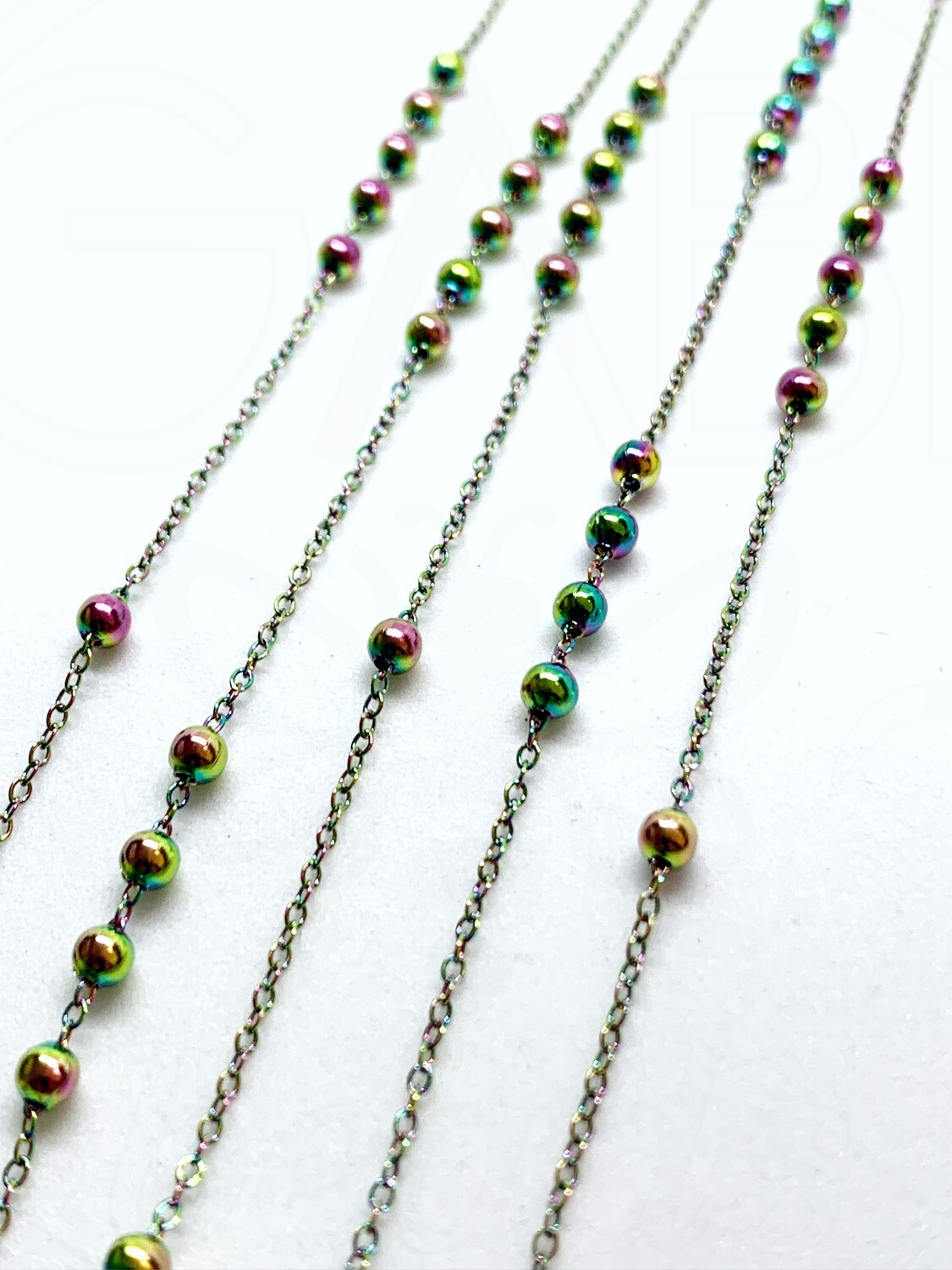 Nerūdijančio plieno grandinėlė , 1,5x1x0,2mm, chameleoninės spalvos, 10cm