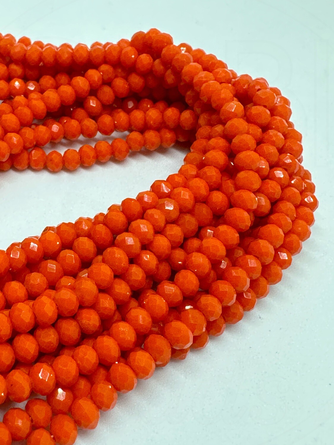 Stiklo kristalai, briaunuoti, rondelės forma, oranžinės spalvos ,4x3mm 44cm juosta