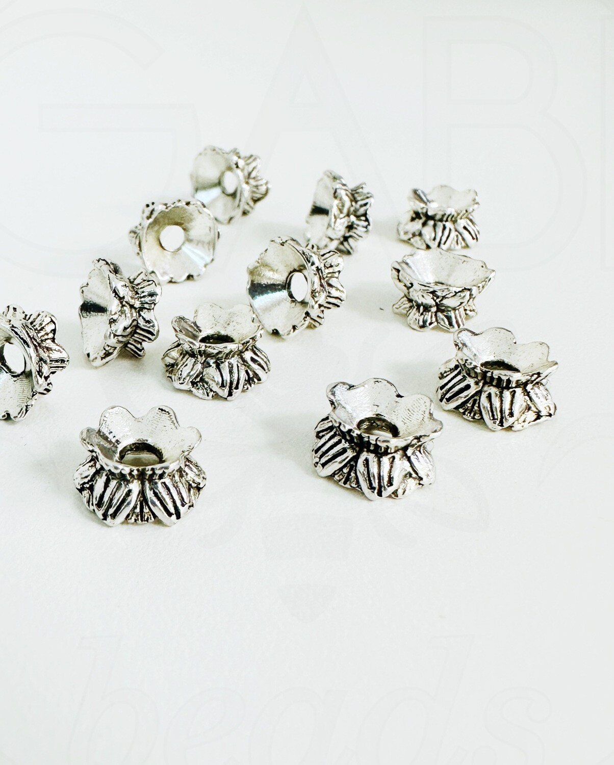 Kepurėlės -intarpai , perveriamos, plieno spalvos, 9x5mm, 14vnt