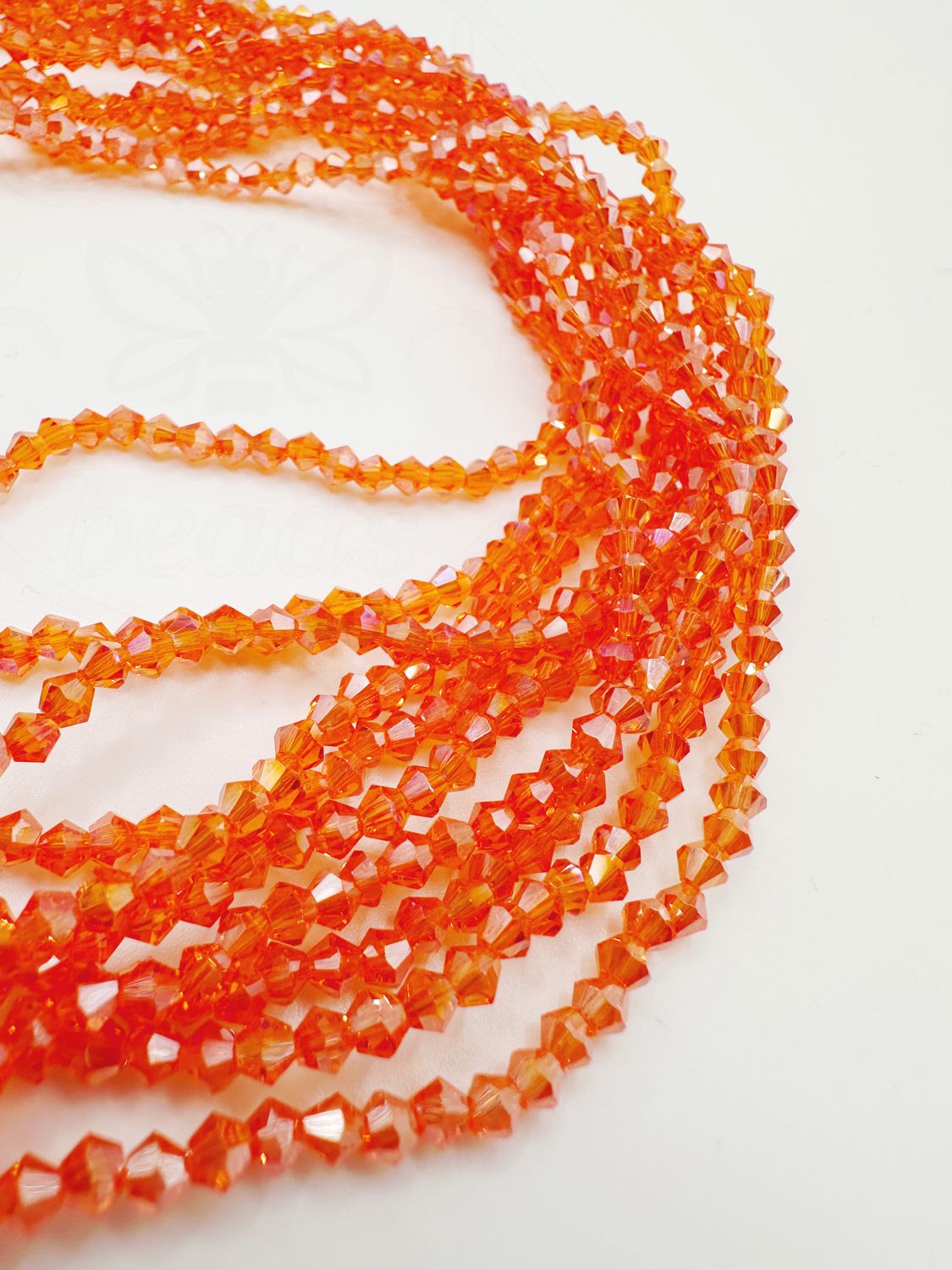 Stikla kristāli, bikona forma, oranžā krāsā ar AB pārklājumu, 3,5~3,8x3~3,5 mm 36 cm sloksne