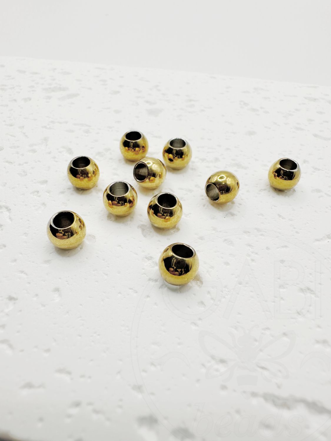 Nerūdijančio plieno intarpai, aukso spalvos, 6x5mm, 3vnt
