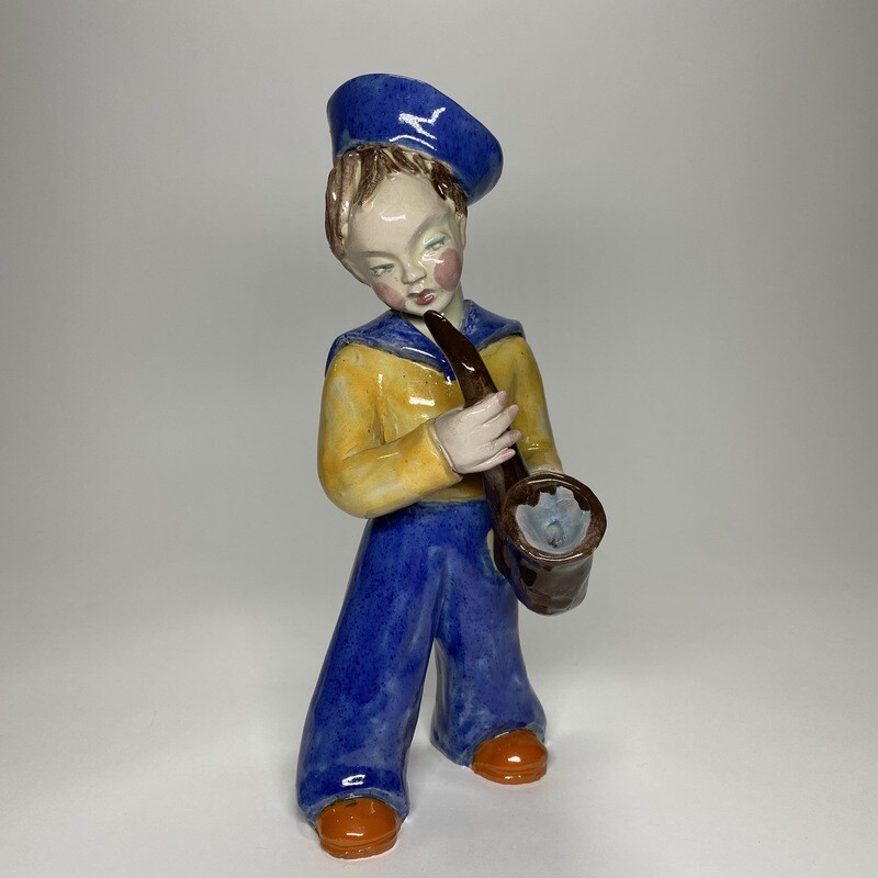 Hungarian Wiener Werkstätte Glazed Ceramic Statue of a Sailor With a Saxophone Designed by Maria Rahmer