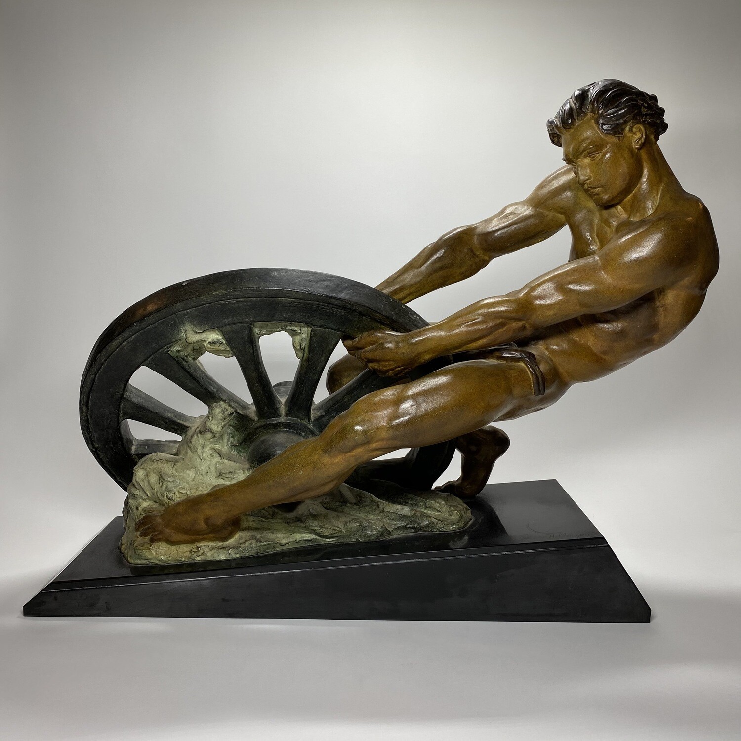 French Art Deco Bronze Statue of a Man Pulling a Broken Cartwheel Designed by A. Margelin