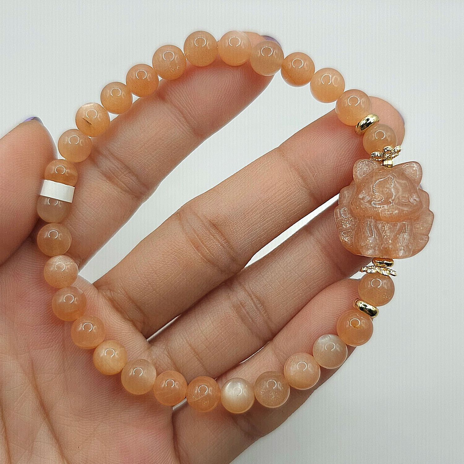 Natural Sunstone with 9 Tail Fox