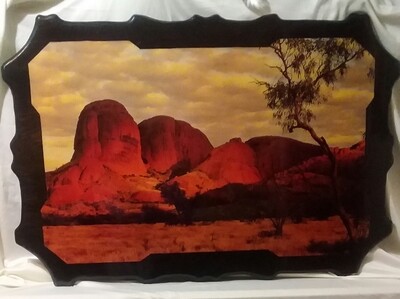 A photo Print of The Olgas displayed on wood