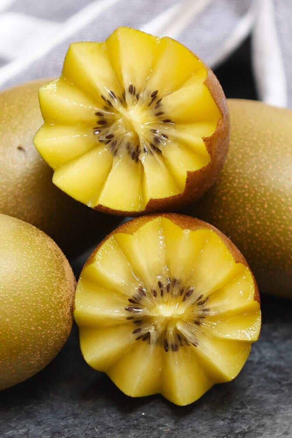 This is Actinidia chinensis. The common name for this is Gold Kiwi Fruit. Whimsy and Wonder Seeds sells the freshest of rare fruit seeds. Other Common names for this exotic fruit species are: Gold Kiwi Fruit: Chinese Gooseberry, Yang Tao. Check this Actinidia chinensis (Gold Kiwi Fruit) out along with all of our other Rare  and Exotic Fruit plant seeds here at Whimsy and Wonder Seeds. We ship these exotic fruit plants seeds  from Canada to anywhere in the World.