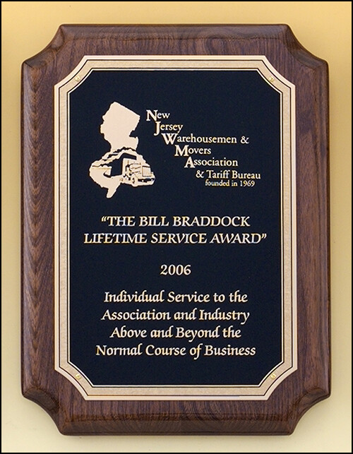 Walnut stained piano-finish plaque with black textured center and florentine border plate