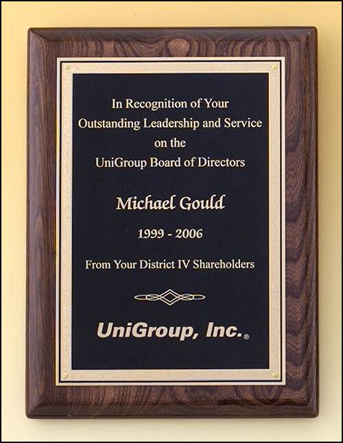 Walnut stained piano-finish plaque with black textured center and florentine border plate