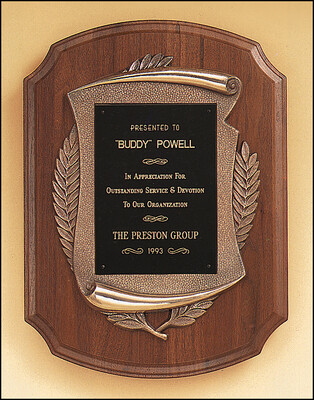 American walnut plaque with furniture finish and an antique bronze finish frame casting