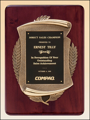 Rosewood stained piano finish plaque with an antique bronze finished frame casting