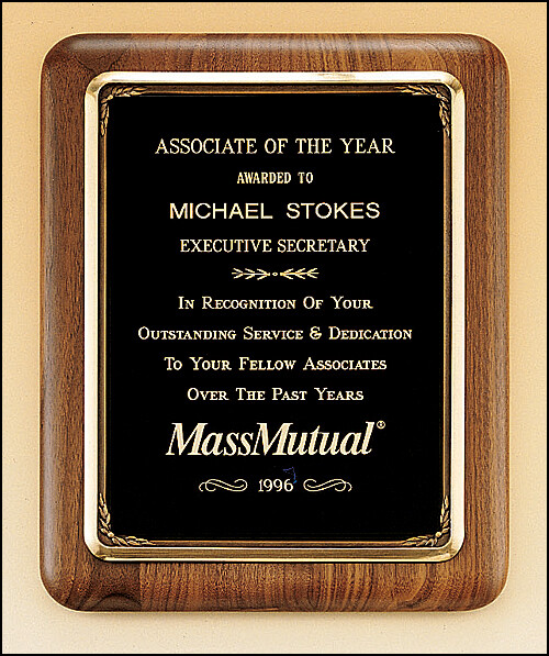 Solid American walnut plaque with an antique bronze plated metal frame casting