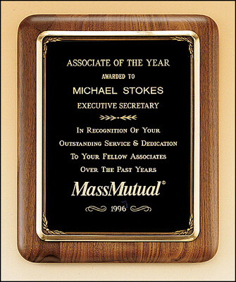 Solid American walnut plaque with an antique bronze plated metal frame casting