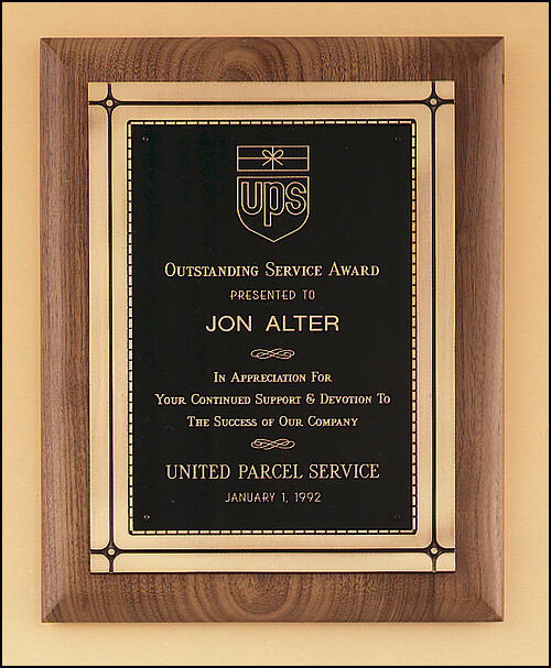 Solid American walnut plaque with an antique bronze Phoenix frame casting