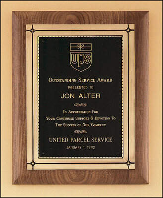 Solid American walnut plaque with an antique bronze Phoenix frame casting