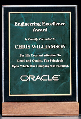 3/4" thick polished acrylic award with an emerald marble center on a solid American walnut base
