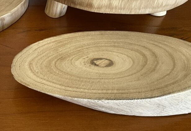 Oval varnished timber base