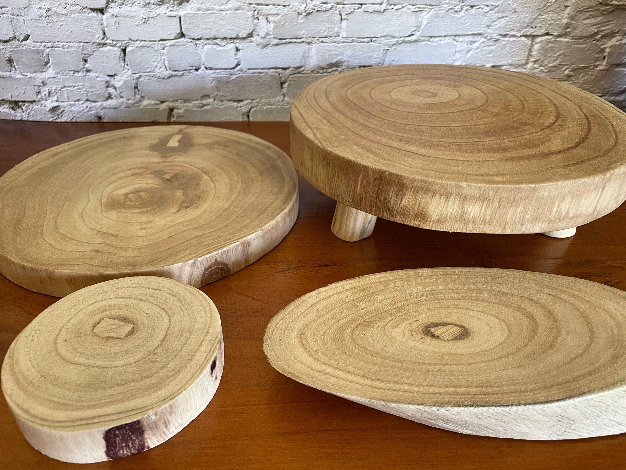 Small round varnished timber base