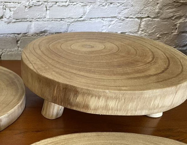 Large round varnished timber base with legs