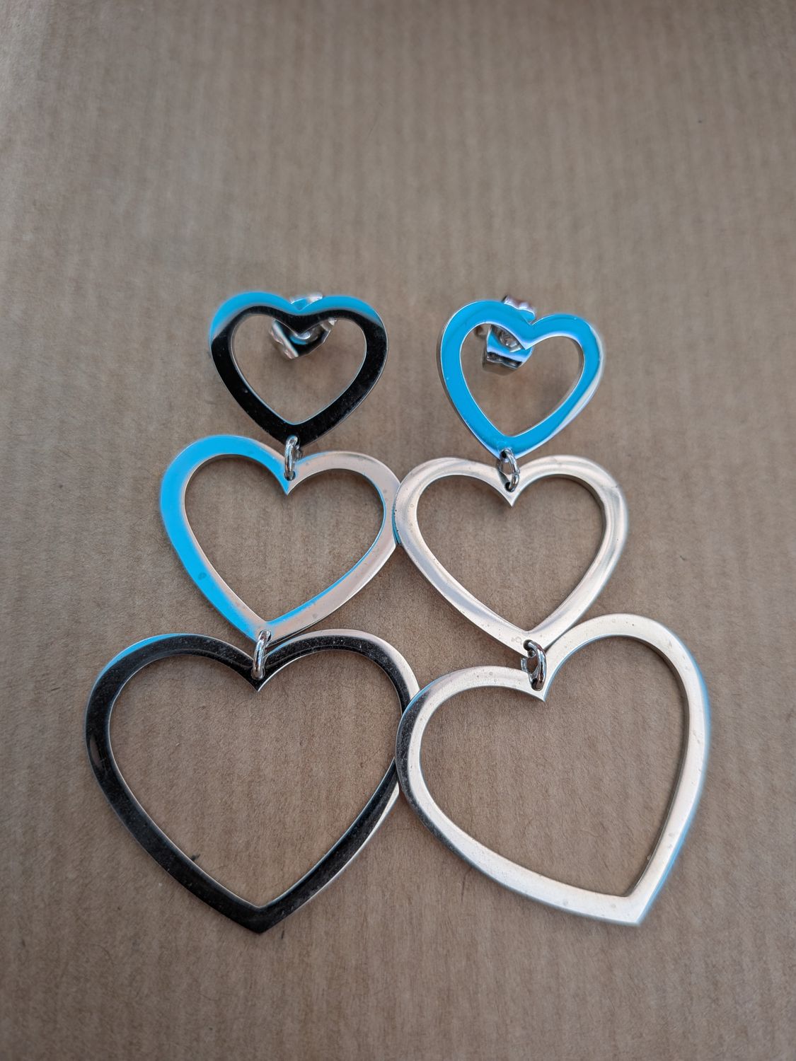 Boucle d'oreille "triple cœur"