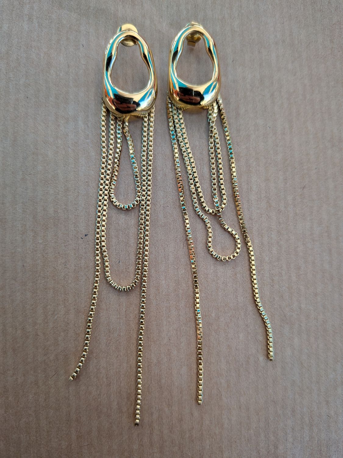 Boucle d'oreille " cascade de chaînes dorées"