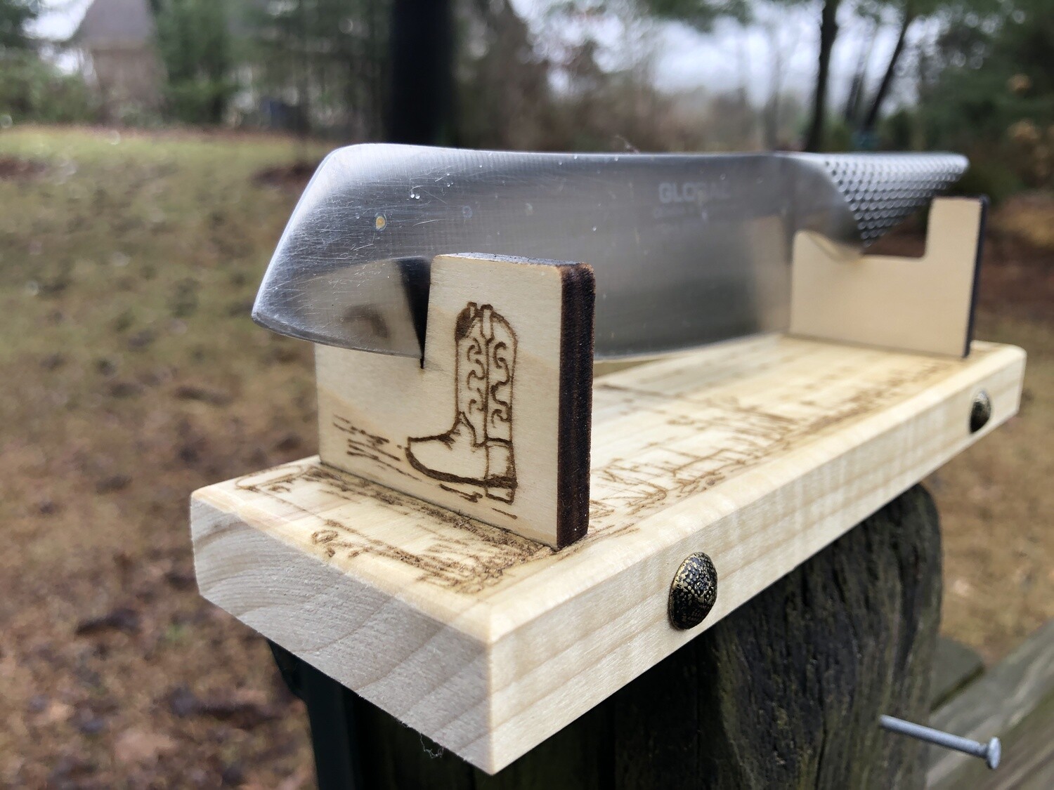 Knife holder for collectibles 8"OD 6" ID: Designed and laser engraved by us: fence posts, barbed wire, meadow grasses, cowboy boot, brass decoration. FREE SHIPPING
