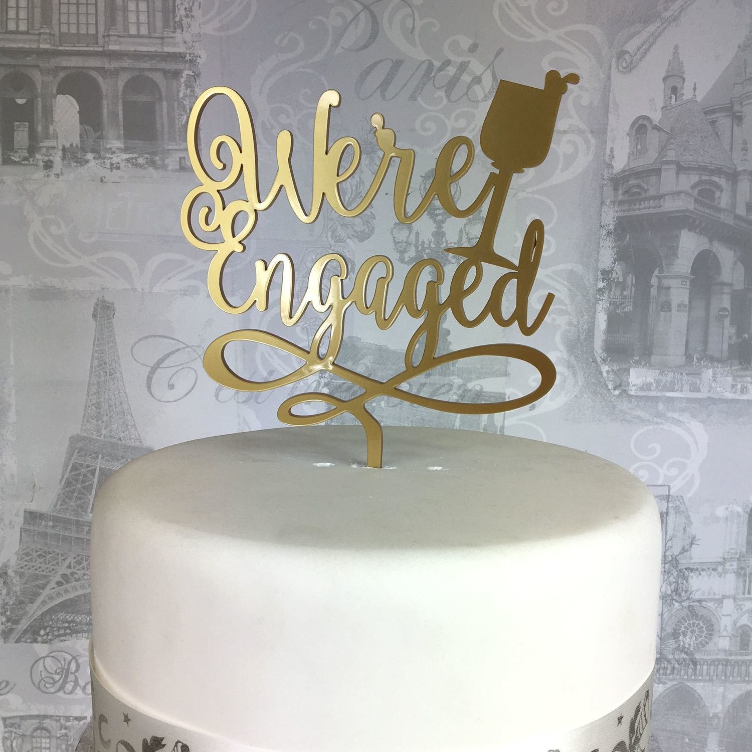 We're Engaged cake topper