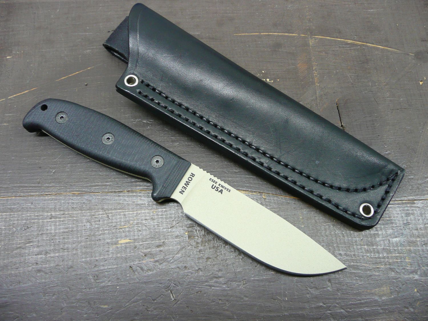 ESEE-4 Fixed Blade Knife, Desert Tan finish, G10 Extended Handles, Black leather sheath ESEE-4 Fixed Blade Knife, Desert Tan finish, G10 Extended Handles, Black leather sheath
