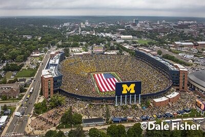 University of Michigan half time show with American flag