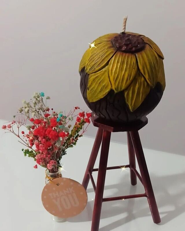 Vela Girasol tallada