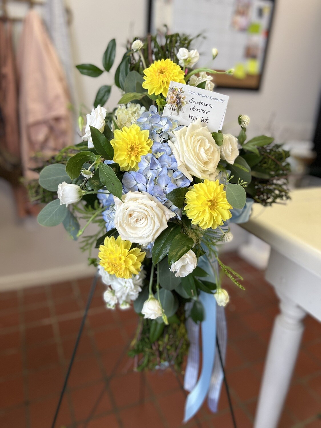 Cross with florals on easel