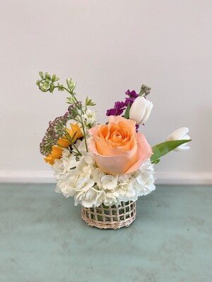 Rattan vase with florals