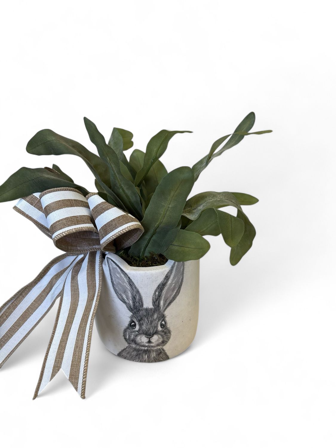 Small flopsy pot with plant