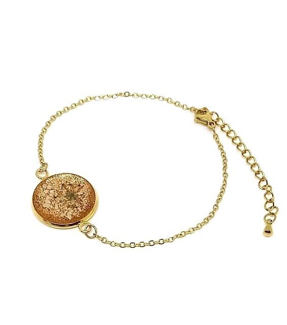 ​Bracelet inox doré, fleur de Carotte sur fond pailleté bronze, D25