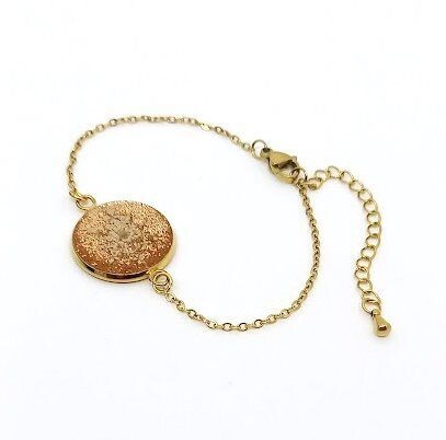 ​Bracelet inox doré, fleur de Carotte sur fond pailleté bronze, D18