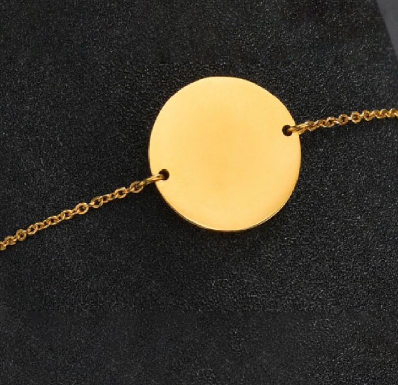 Pulsera oro rosa con placa circular de acero inoxidable