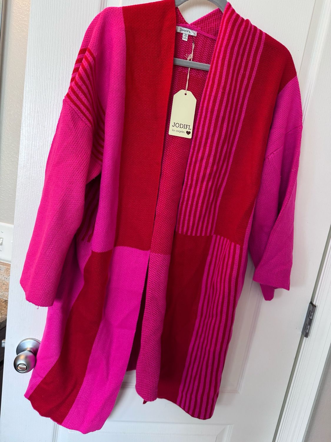 Size small ￼ color block, pink and red sweater NWT