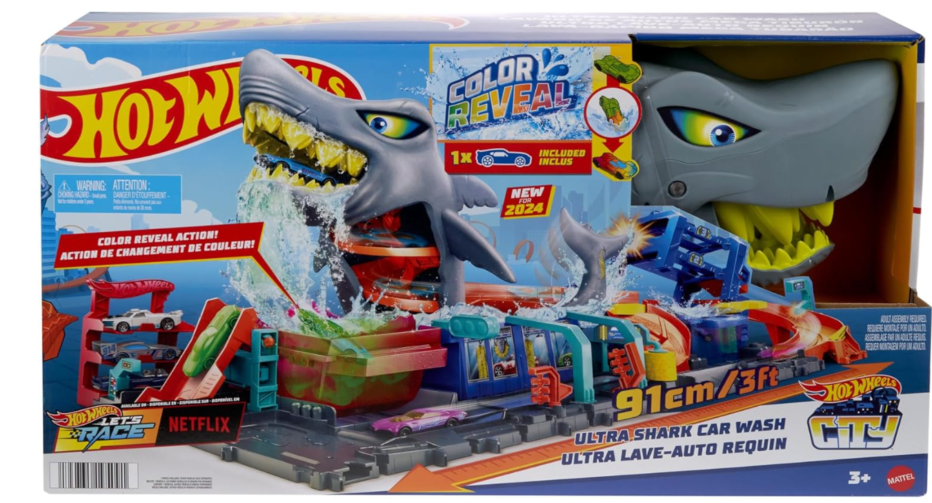 Hot Wheels 'Let's Race' Netflix - Mega Squalo Autolavaggio, pista con rullo di schiuma e cancelli mobili, funzione cambia colore e macchinina Color Reveal inclusa, 3+ anni, HTN82