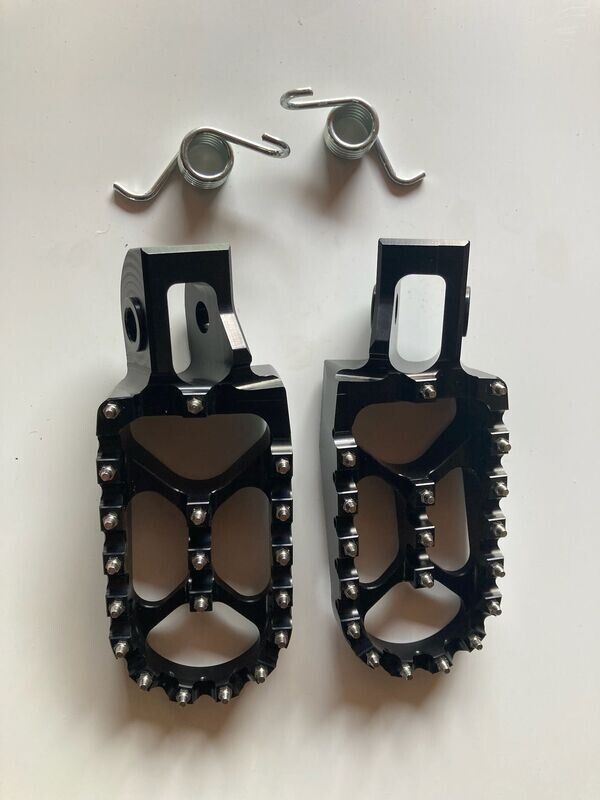 OEM Cleated Aluminum Foot Pegs with Spring fits TSE & FSE R Models.