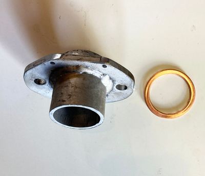 Exhaust Pipe Adapter for TSE250R. Works with spring mounted pipes with 43mm I.D. Comes with copper washer gasket.
