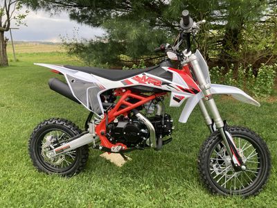 MFC RX125E Pit Bike 125cc air cooled 4 stroke engine 4 speed manual transmission, Electric start, with kick start backup 12"-14" wheels 31.9" seat height 11" ground clearance Inverted Forks. more...
