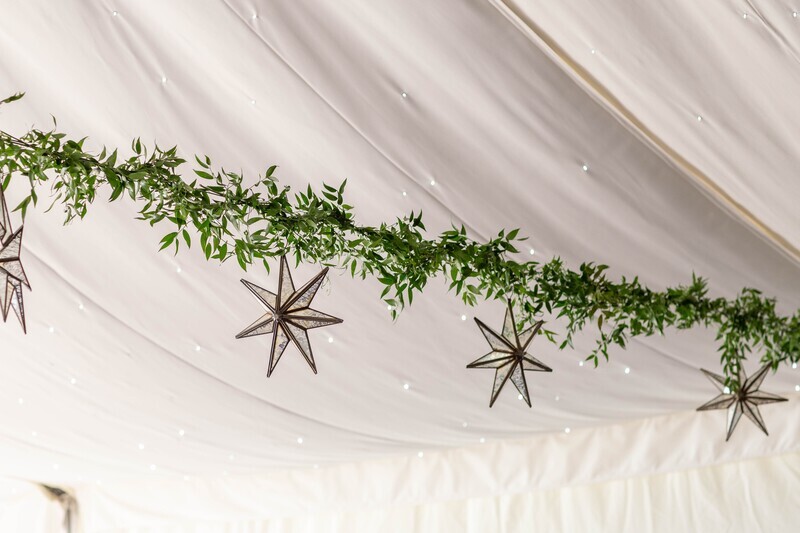 Ceiling garlands with French Connection suspended stars