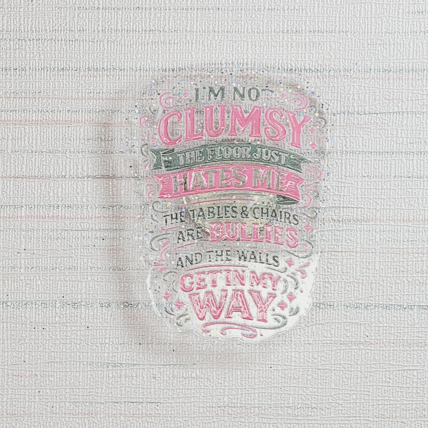 Cover Minder I'm not clumsy, the floor just hates me,  the table and chairs are bullies and the walls get in my way