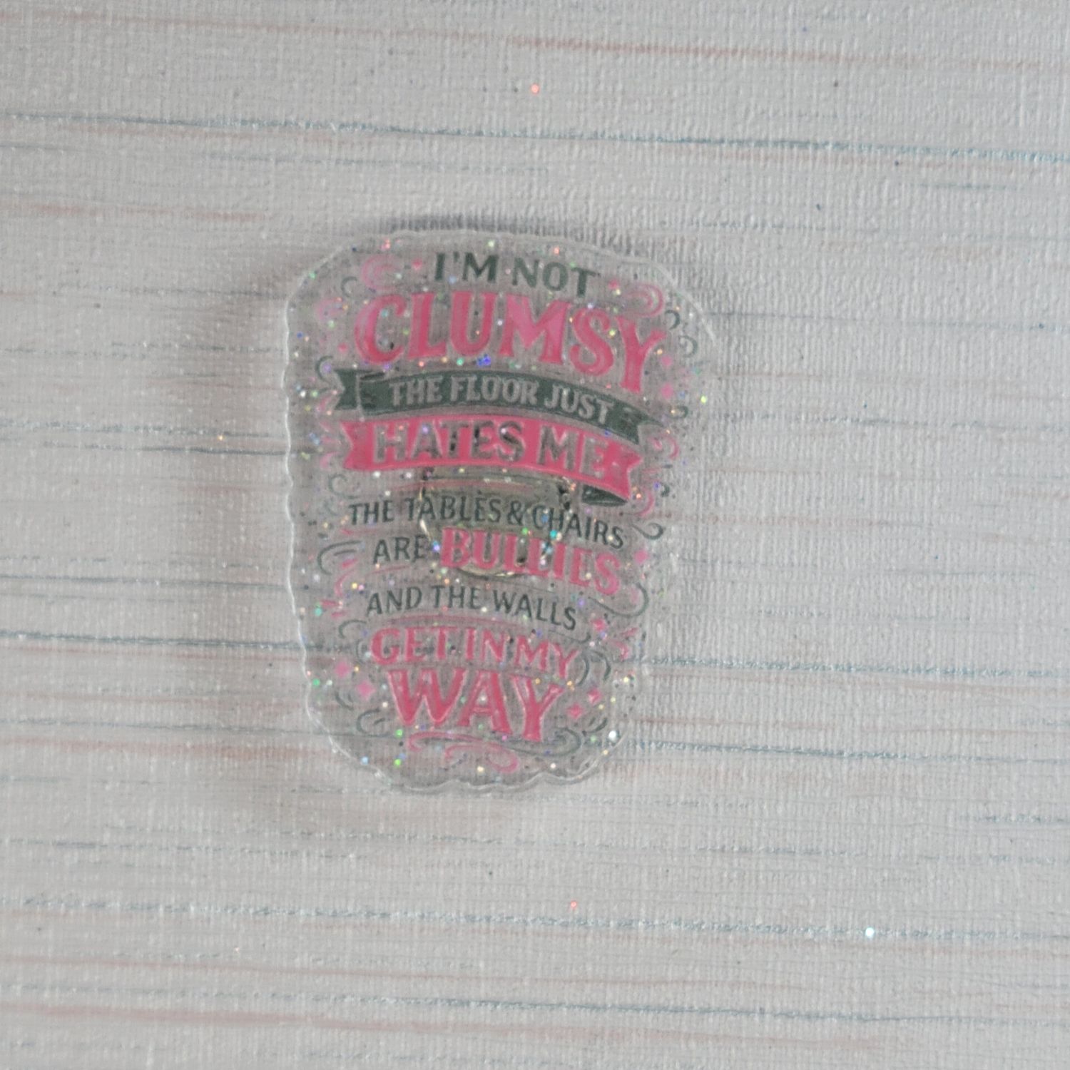 Cover Minder I'm not clumsy, the floor just hates me,  the table and chairs are bullies and the walls get in my way