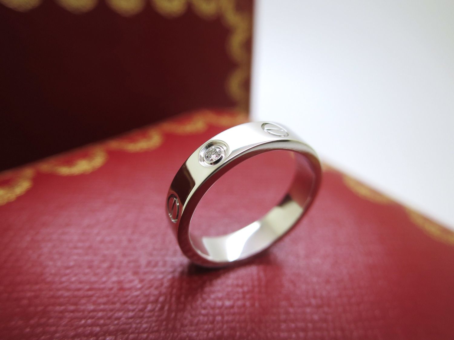 Cartier Love Ring in 18kt White Gold + Diamond in Band Size 5 comes with Certificate of Authenticity + Red Box