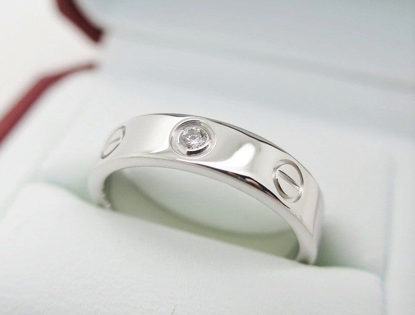 Cartier Love Ring in 18kt White Gold + Diamond in Band Size 5.5 comes with Certificate of Authenticity + Red Box