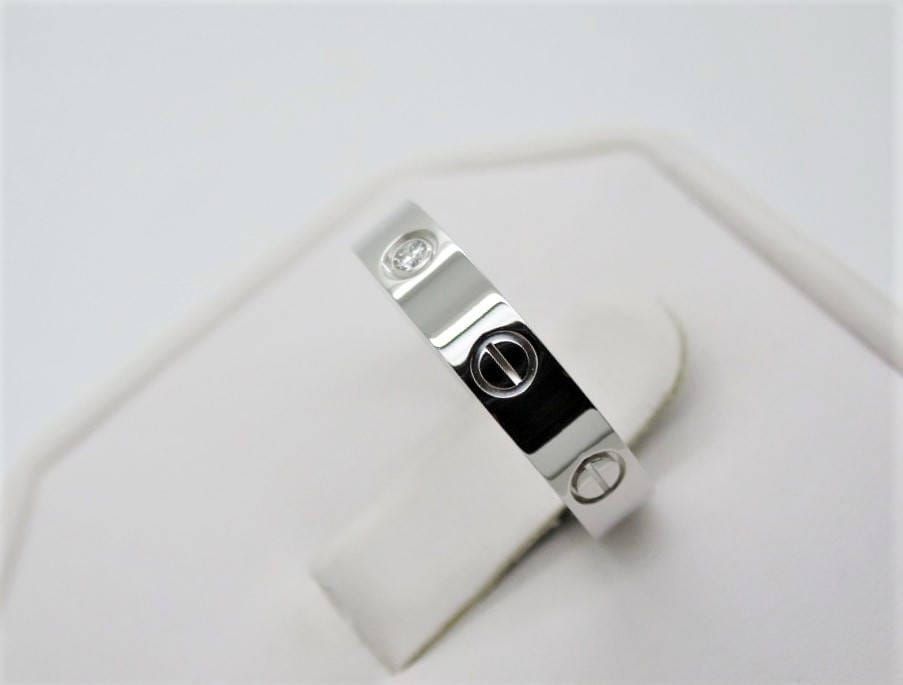 Cartier Love Ring in 18kt White Gold + Diamond in Band Size 5.5 comes with Certificate of Authenticity + Red Box