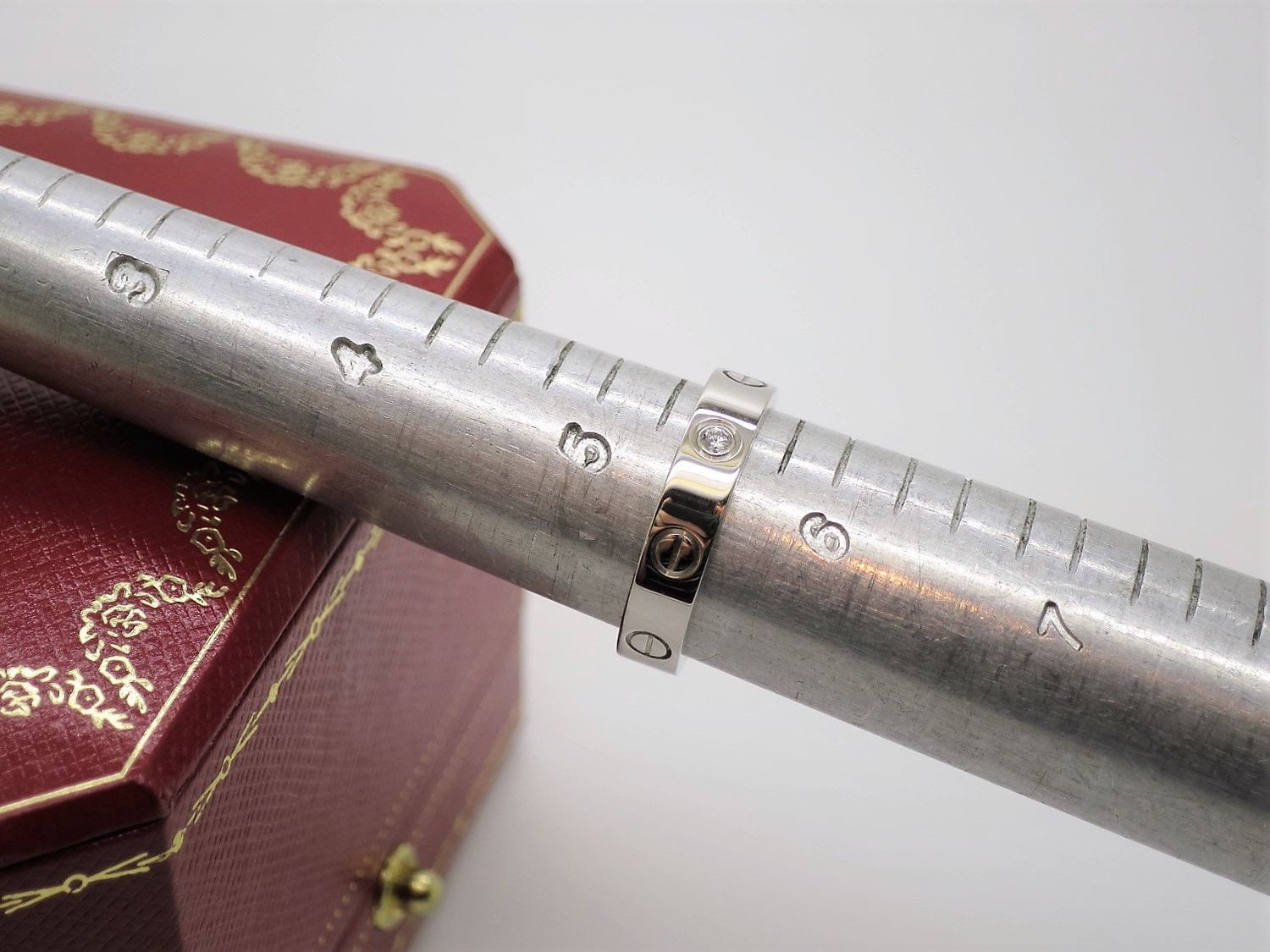 Cartier Love Ring in 18kt White Gold + Diamond in Band Size 5.5 comes with Certificate of Authenticity + Red Box