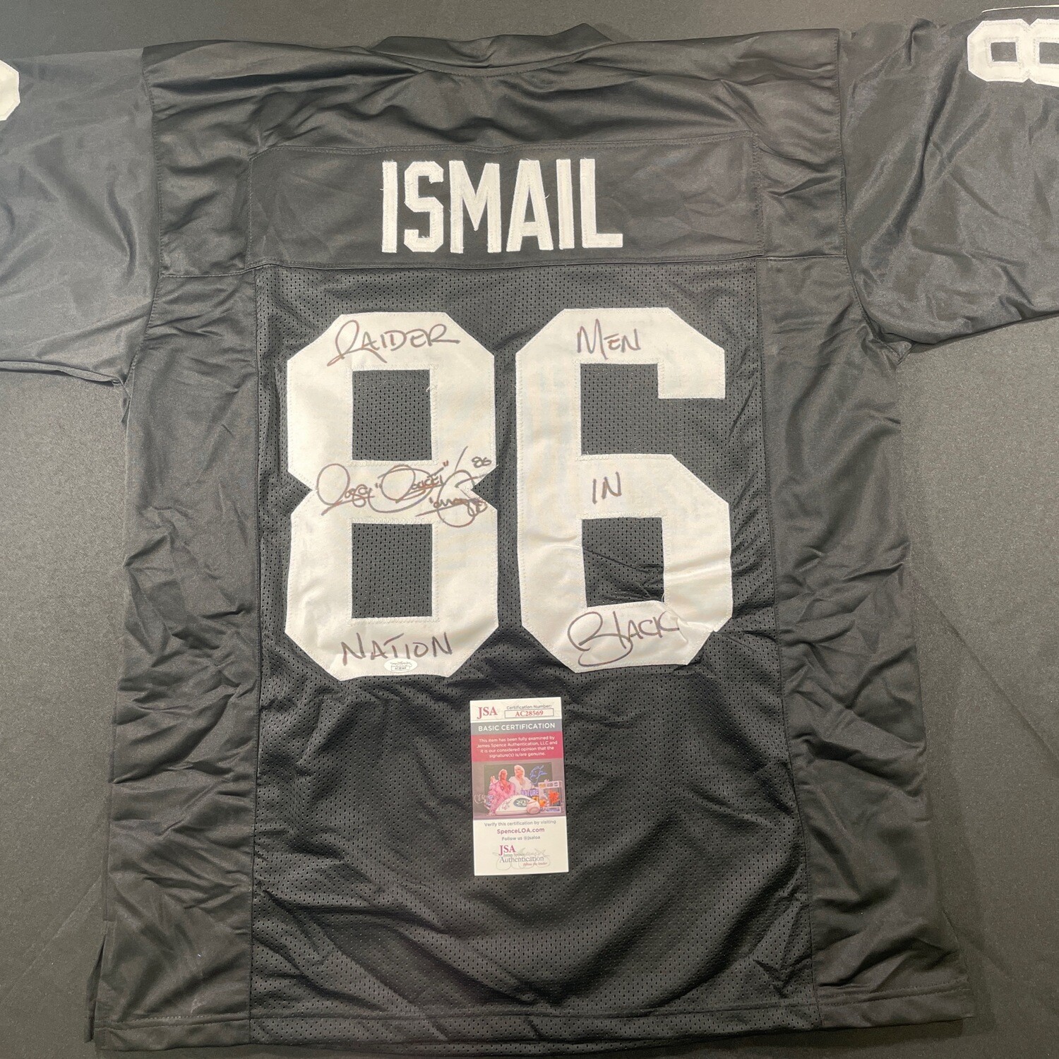 Rocket Ismail Oakland Raiders Autographed Jersey(Full Signature) w/Men in Black