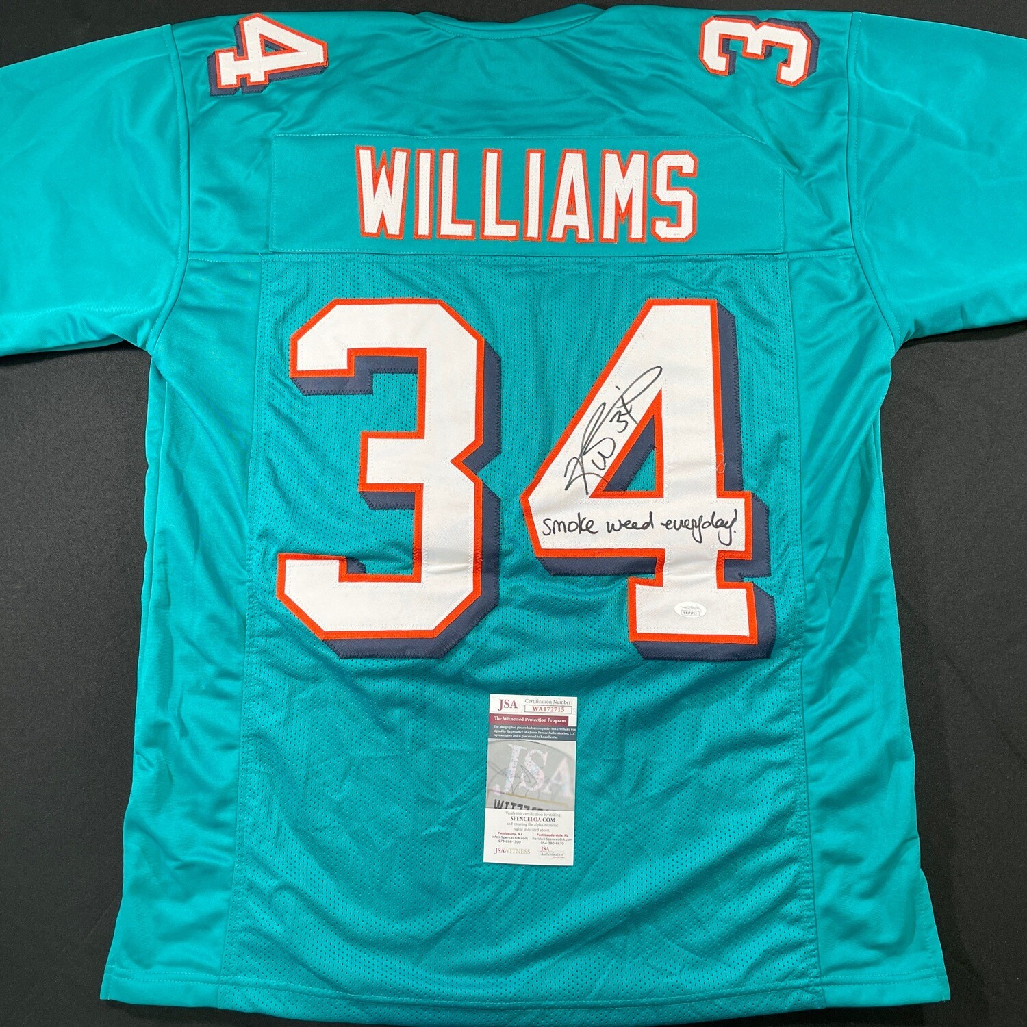 Ricky Williams Miami Dolphin Teal Autographed Jersey & Inscription “ Smoke Weed